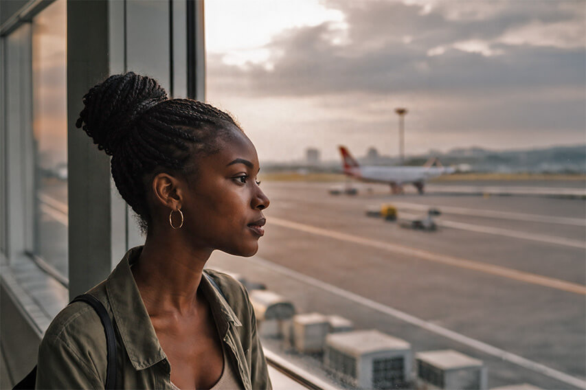 A young Black woman with braided hair